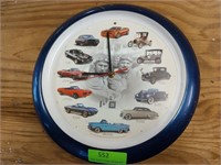 Plastic GM 100 yrs clock 13"