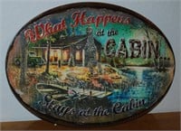 "WHAT HAPPENS AT THE CABIN" METAL SIGN