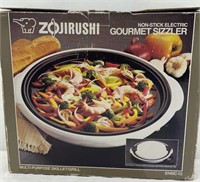 Non- stick electric gourmet sizzler - red color