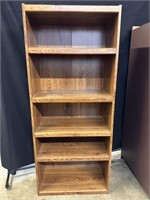 Tall light brown bookshelf