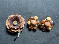 Vintage metal flower with amber rhinestone center