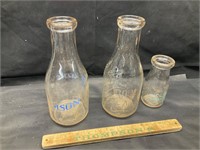 3 vintage milk bottles