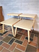 2 mid century modern blond step side tables-