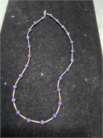 Gold tone and purple bead necklace