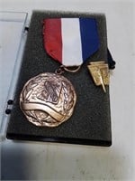 National Honor Society pin and another award medal