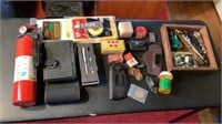 Assortment of items, fire extinguisher and gun