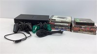 PlayStation 2 console with games, power cord,