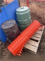 Composter and a roll of snow fencing