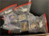 Assorted bags of sports cards