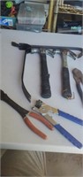Lot of hammers crowbars and cutters