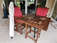 Wooden patio table with umbrela and two wooden