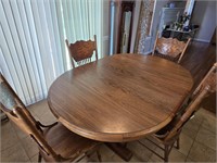 Dining table with four pressback chairs