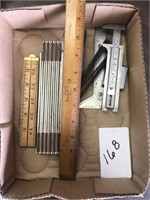 Flat of old measuring rulers