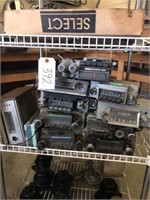 Shelf - collection of old car radios and an 8
