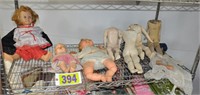 Shelf of old dolls & related
