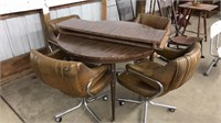 VINTAGE DINING TABLE W/LEAF AND 4 CHAIRS ON WHEELS
