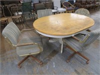 GOOD PAINTER DINING TABLE W/ 4 ROLLING CHAIRS