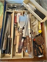 Flat of kitchen knives and gadgets