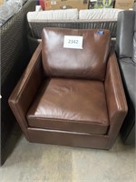 Brown leather swivel arm chair