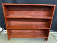 Short red bookshelf