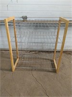 A beautiful light brown wooden and metal rack