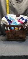 Wicker Basket Full Of Hand Towels And A Bar Of