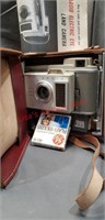 Antique Polaroid cameras/ lenses and books.