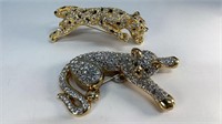 Large rhinestone reclining cat and standing lion