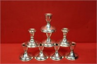 Six weighted sterling candlesticks