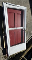 STORM DOOR AND RED WOODEN DOOR