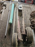 two tires with axle, PVC pipe; seeder