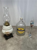 Vintage oil lamp, advertising glass bottle, and