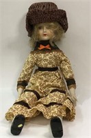 Doll In Brown Hat And Dress
