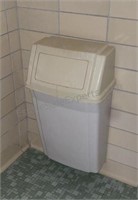 Wall mounted trash can.
