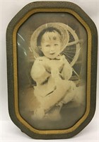 Photograph Of Child In Convex Frame