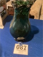 Heavy hand blown
Green glass vase