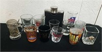 Collectible shot glasses and a flask