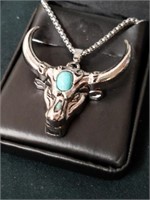 Cow necklace with turquoise colored Stone