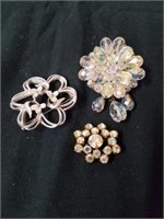 Three women's brooches two of them look vintage