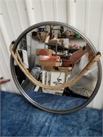 New round mirror that hangs by a rope 22.5 in