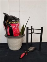 Adjustable planter stand with potting soil