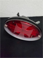 Motorcycle tail light with Maltese cross