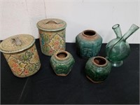 Vintage metal canisters, decorative planters, and