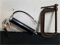 Large vintage clamp and a grease gun