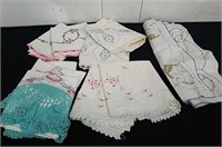 Four sets of vintage hand stitched pillowcases