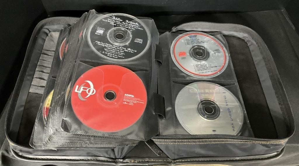 Binder of DVD Movies & CDs.