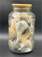 Vintage lidded jar full of shells