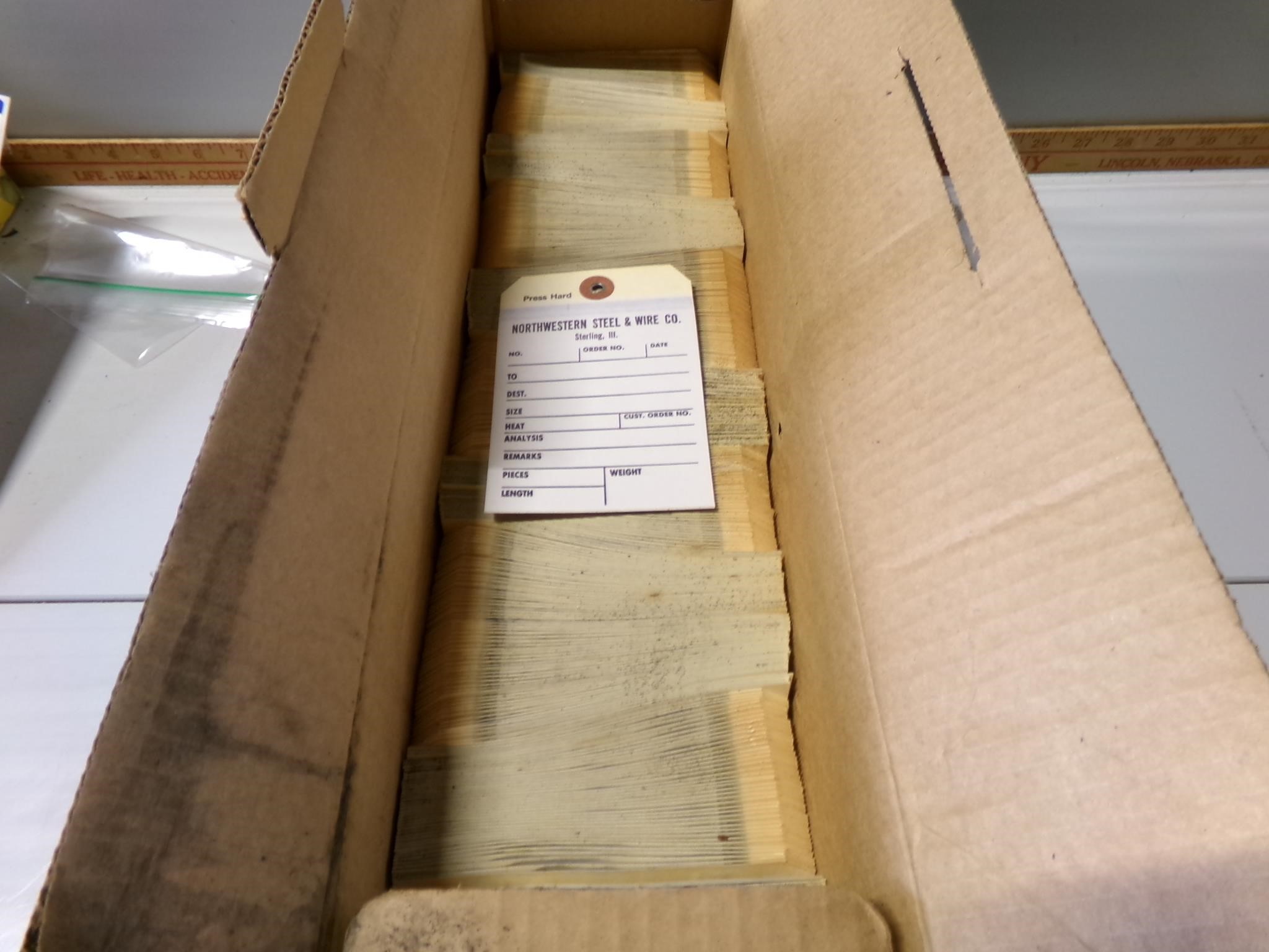 Box of North Western steel and wire tags