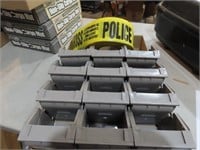 Police tape, plastic storage bins.