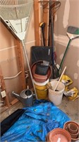Assorted gardening tools and buckets